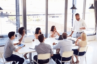 Teacher and Students around table